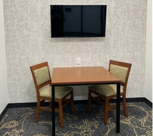 This room has a square table and two chairs.