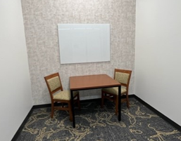 This room has a square table and two chairs.